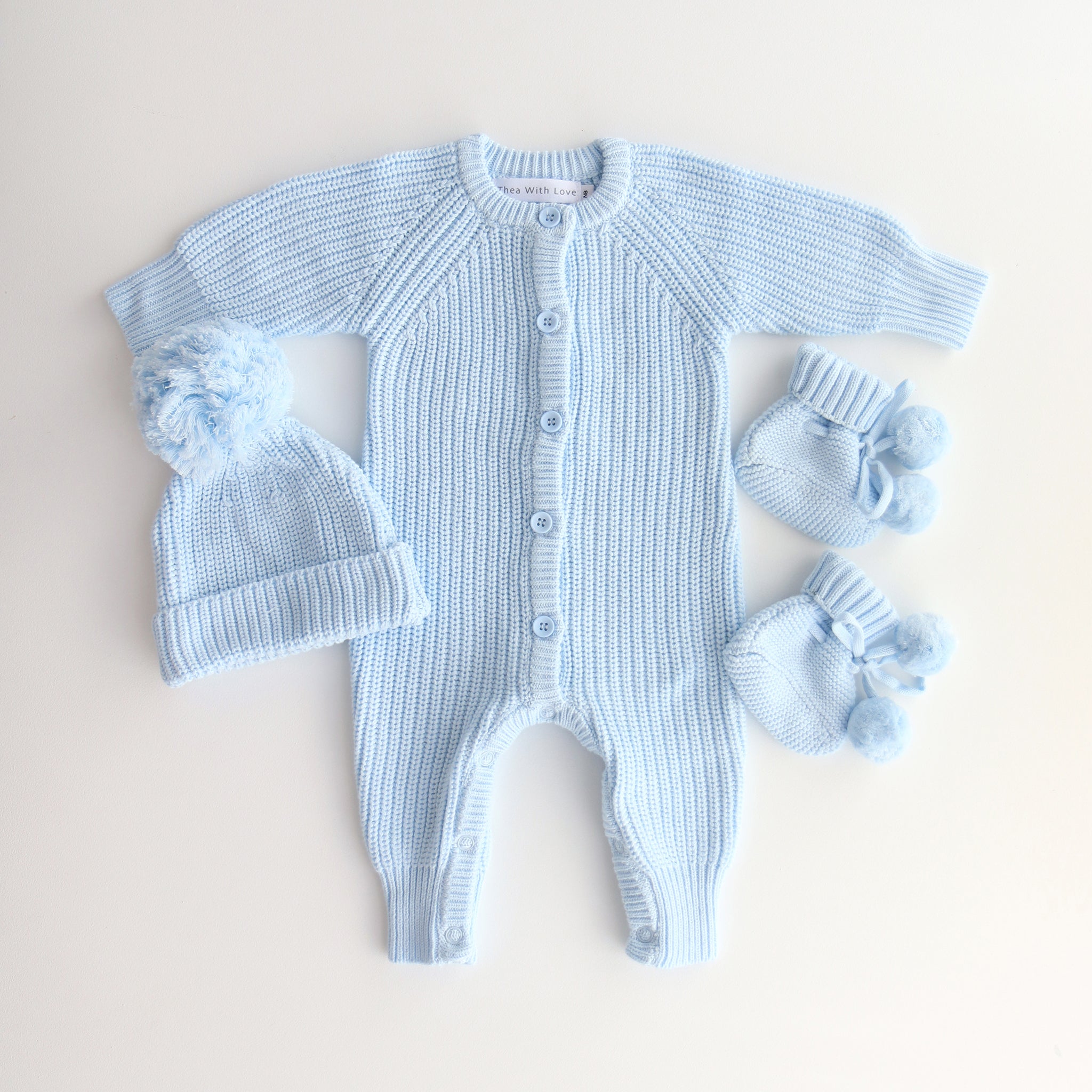 flatlay romper booties beanie - baby blue