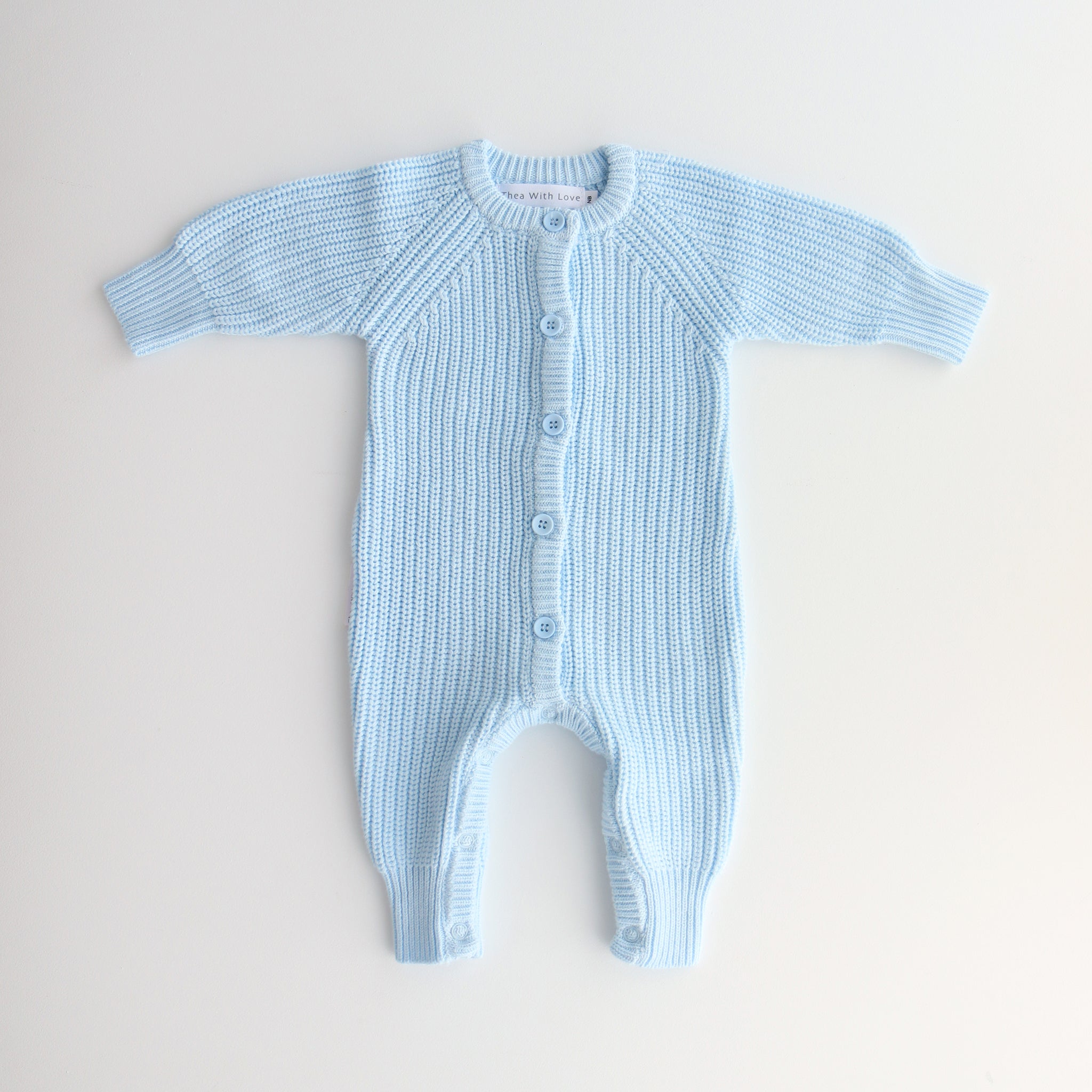 chunky knit baby blue romper flatlay