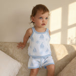 cotton knitted shorts with blue boat pattern on white background. Blue trims and blue elastic waist with drawstring. Waist band is 4 cm high and the leg trim is 1.5 cm high