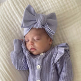 baby wearing the one size lavender bow