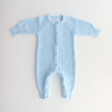 chunky knit baby blue romper flatlay