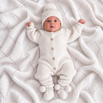 Baby wearing Warm White knit romper, 6–12 months – Thea With Love