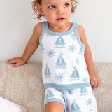 Toddler wearing the Coastal knit shorts and singlet top set with sailboat and sun pattern