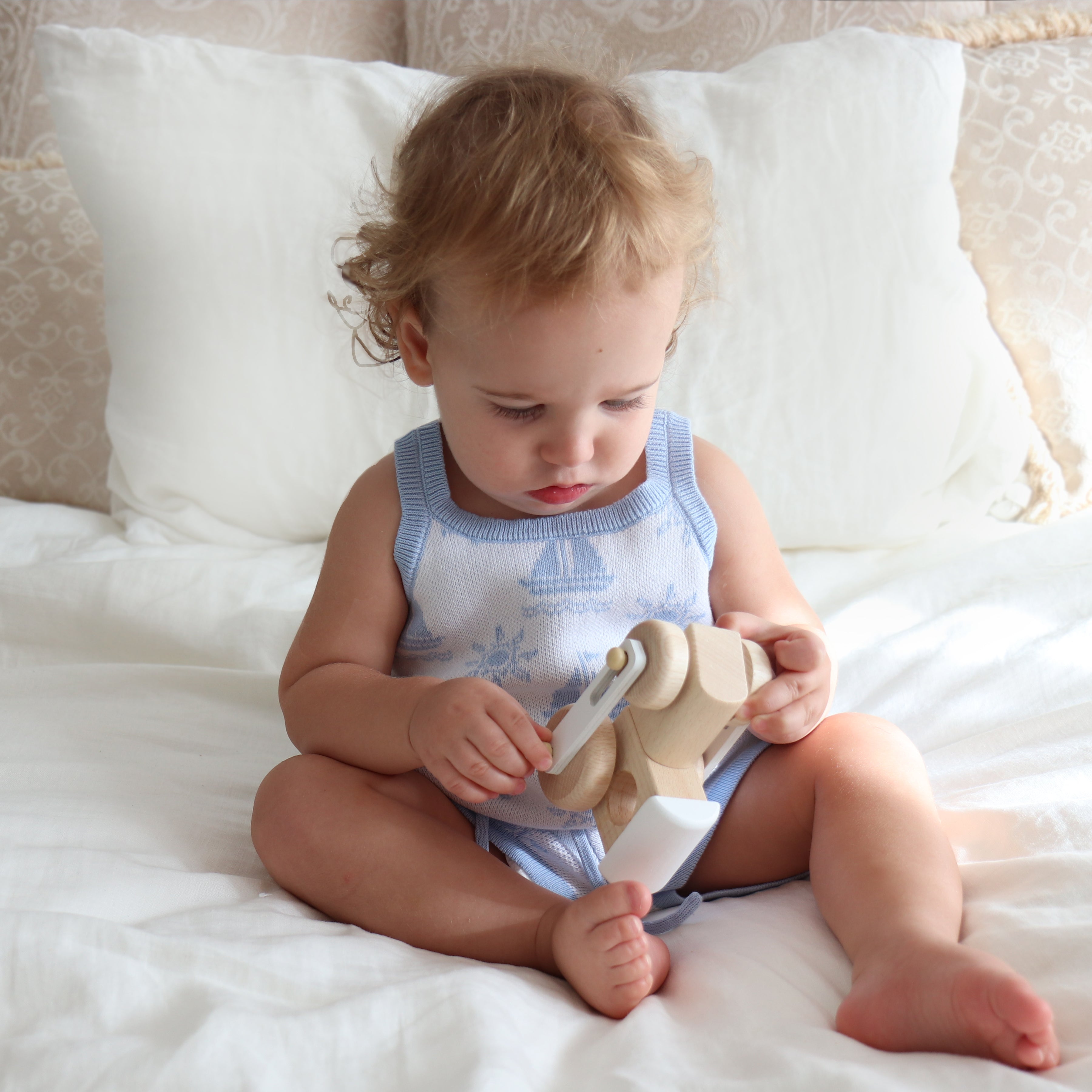 cotton knitted top with blue boat pattern on white background. Blue trims around neck shoulder and legs is 1.5 cm