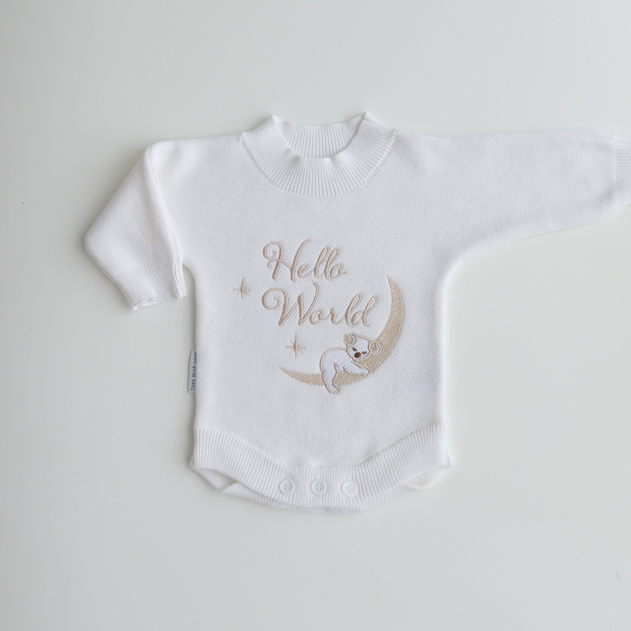 koala-hello-world-embroidered-on centre front in soft golden yarn. Koala is sleeping on the moon. He has the cutest face