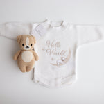Flatlay of the Hello World Koala romper showing the embroidery imperfection — the koala’s face appears untidy with a slightly larger nose.