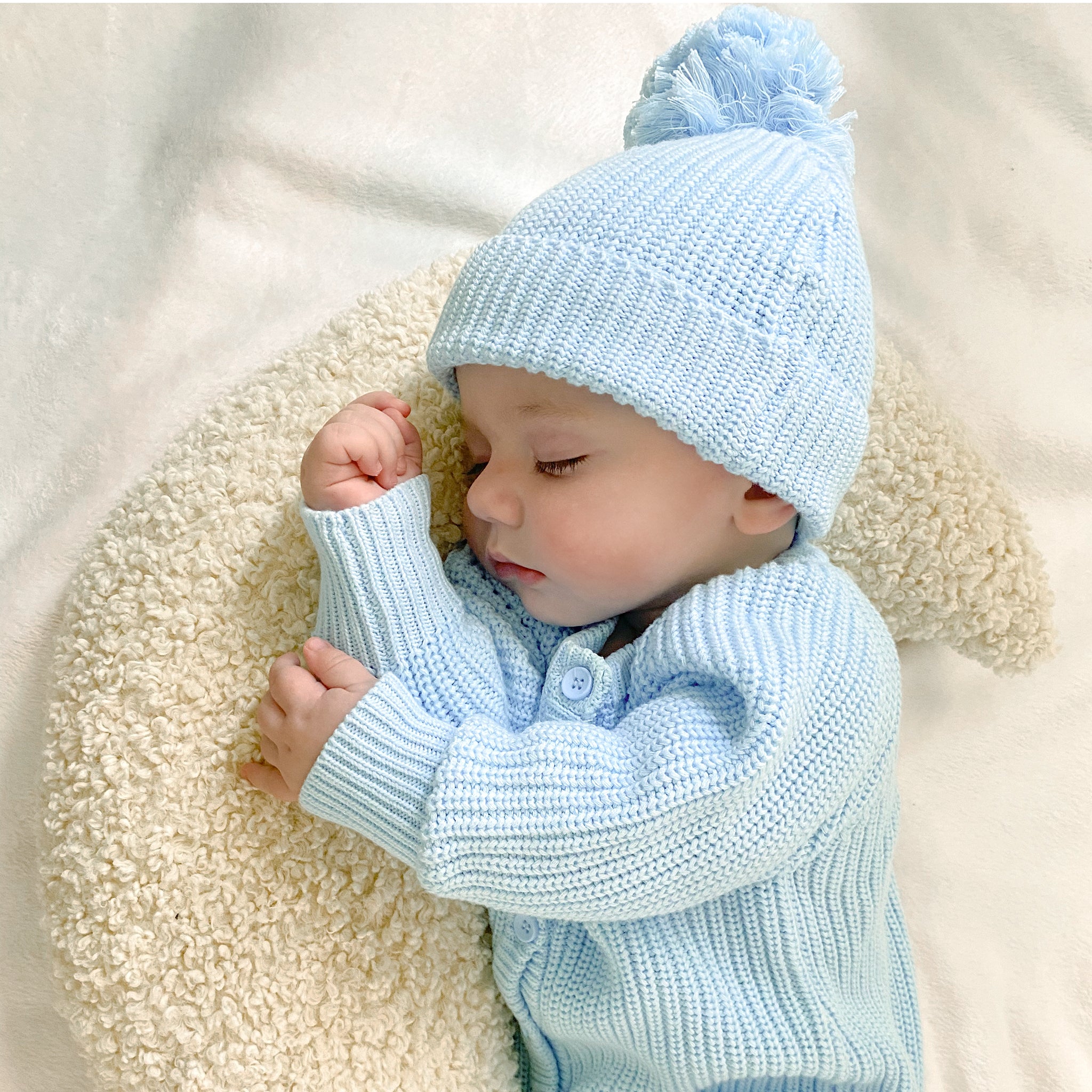 knitted baby beanie with pom pom chunky knit for softness and warmth