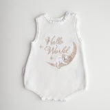 Our koala hello world summer features a baby koala sleeping on eclipse shape  moon. 2 stars are also added. The embroidery is running writing. The embroidery yarn is glossy so the hello world shines in the sunlight. Romper is white knitted fabric. short sleeves and legs for summer. 