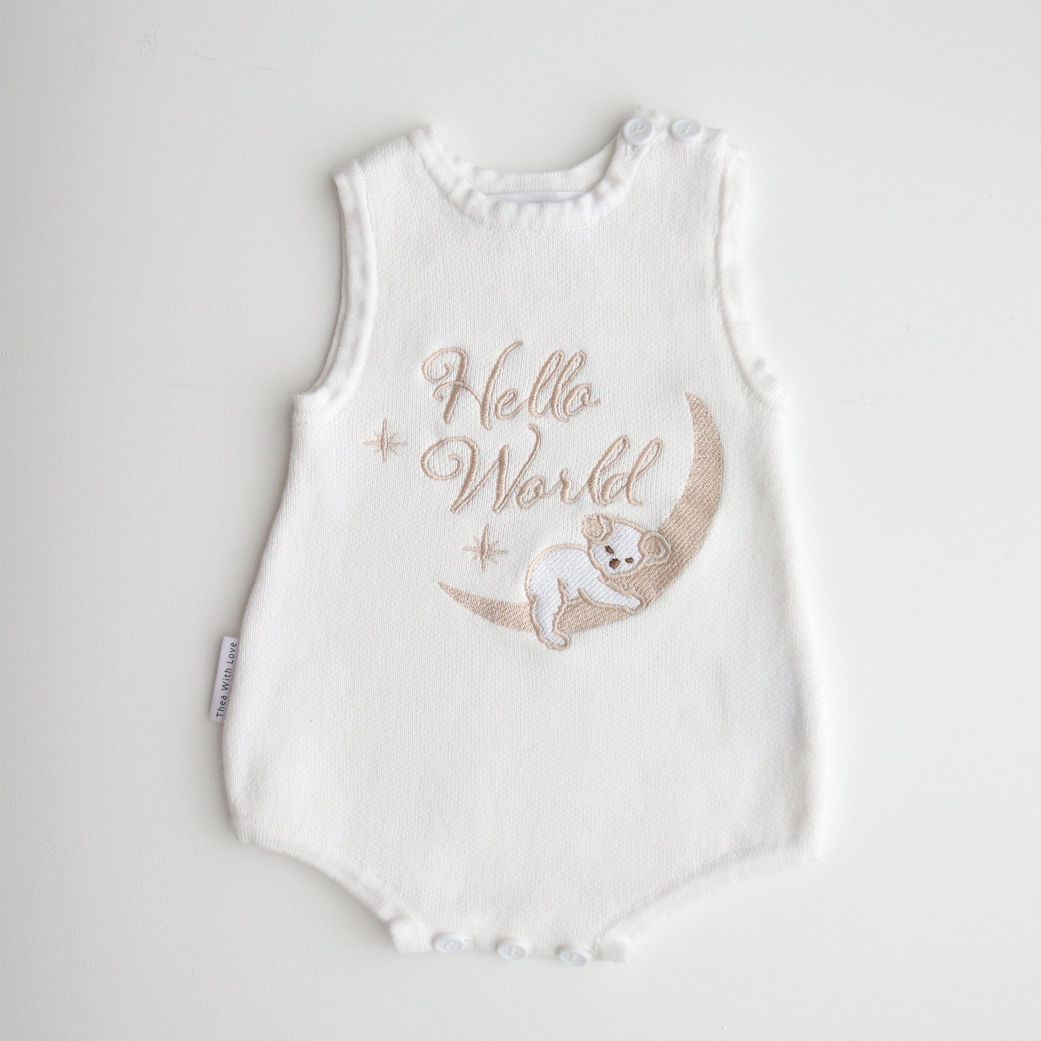 Our koala hello world summer features a baby koala sleeping on eclipse shape  moon. 2 stars are also added. The embroidery is running writing. The embroidery yarn is glossy so the hello world shines in the sunlight. Romper is white knitted fabric. short sleeves and legs for summer. 