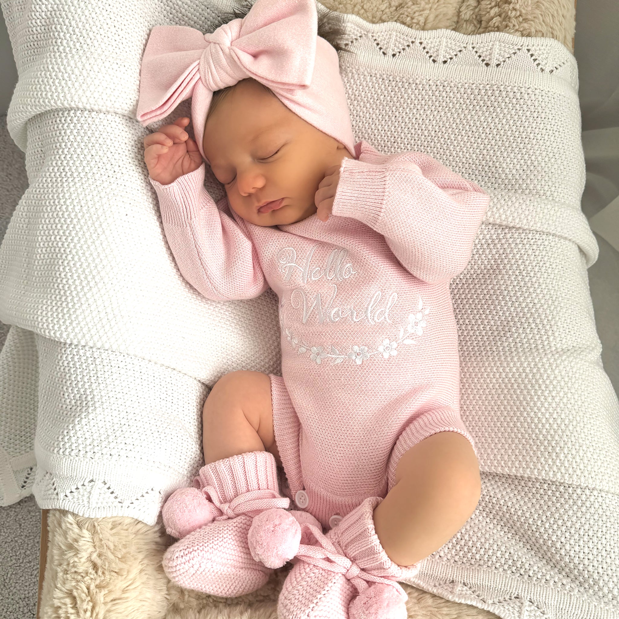 Pretty Pink Hello World Bundle With Bow. The embroidery hello world is in white yarn and it is placed in the centre of romper chest area so it is clearly seen in your announcement photos match with bow and booties