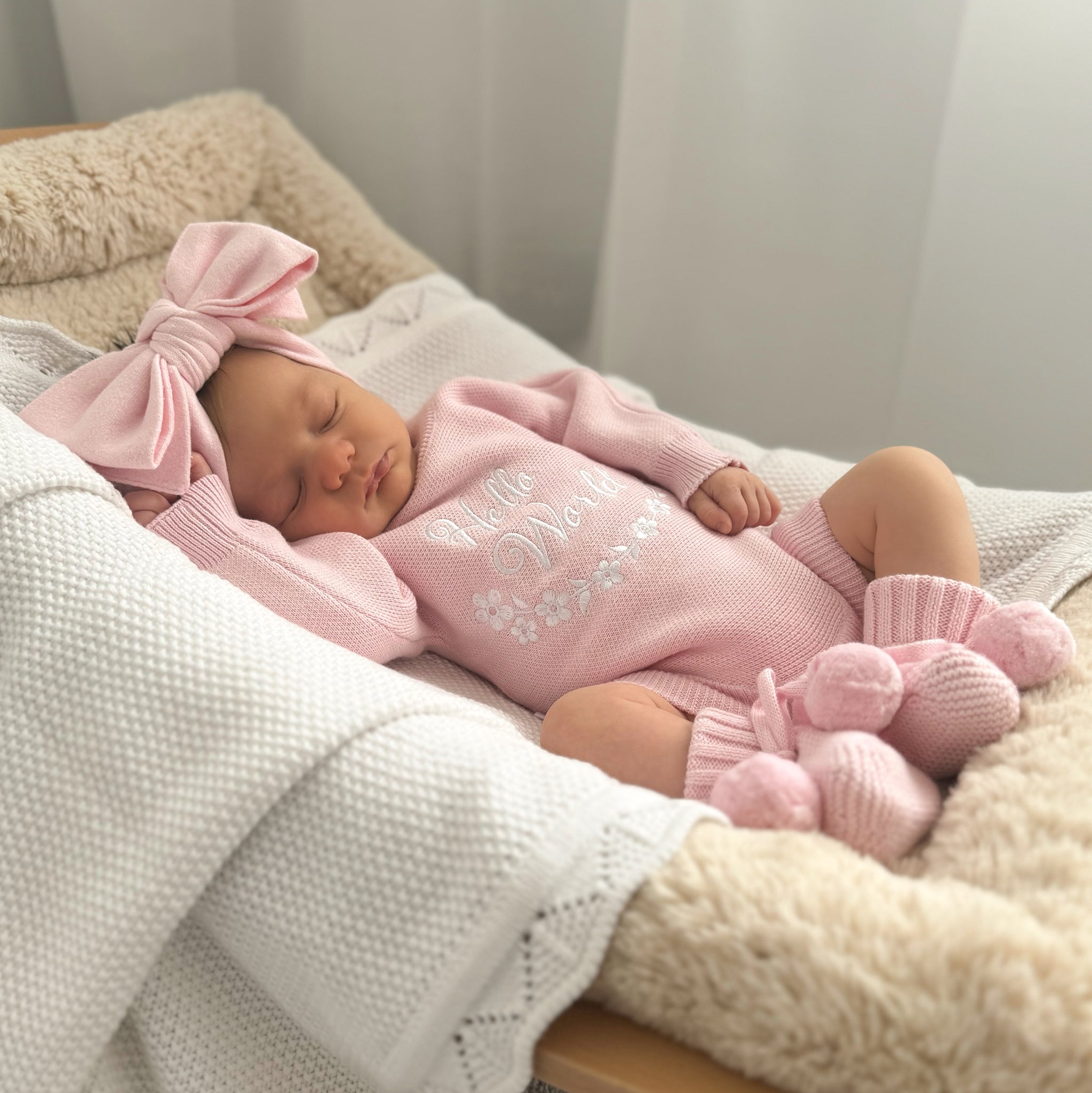Pretty Pink Hello World Bundle With Bow. The embroidery hello world is in white yarn and it is placed in the centre of romper chest area so it is clearly seen in your announcement photos match with bow and booties