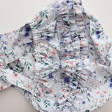 flatlay showing a close up of the 3 tier frill on the bottom