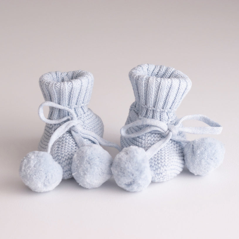 sky booties with pom pom