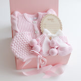 Baby Gift Set – Pretty Pink Frill Knit Romper, Booties, Bonnet & Disc She's Here, White Ribbon