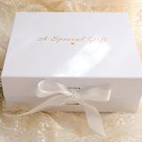 Baby Gift Set – Warm White Knit Romper, Booties, Bow & Disc She's Here, White Ribbon