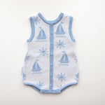 blue trim leg neck sleeves and centre trim also blue with blue snap buttons and snap buttons on crotch, sun and boat pattern on white background