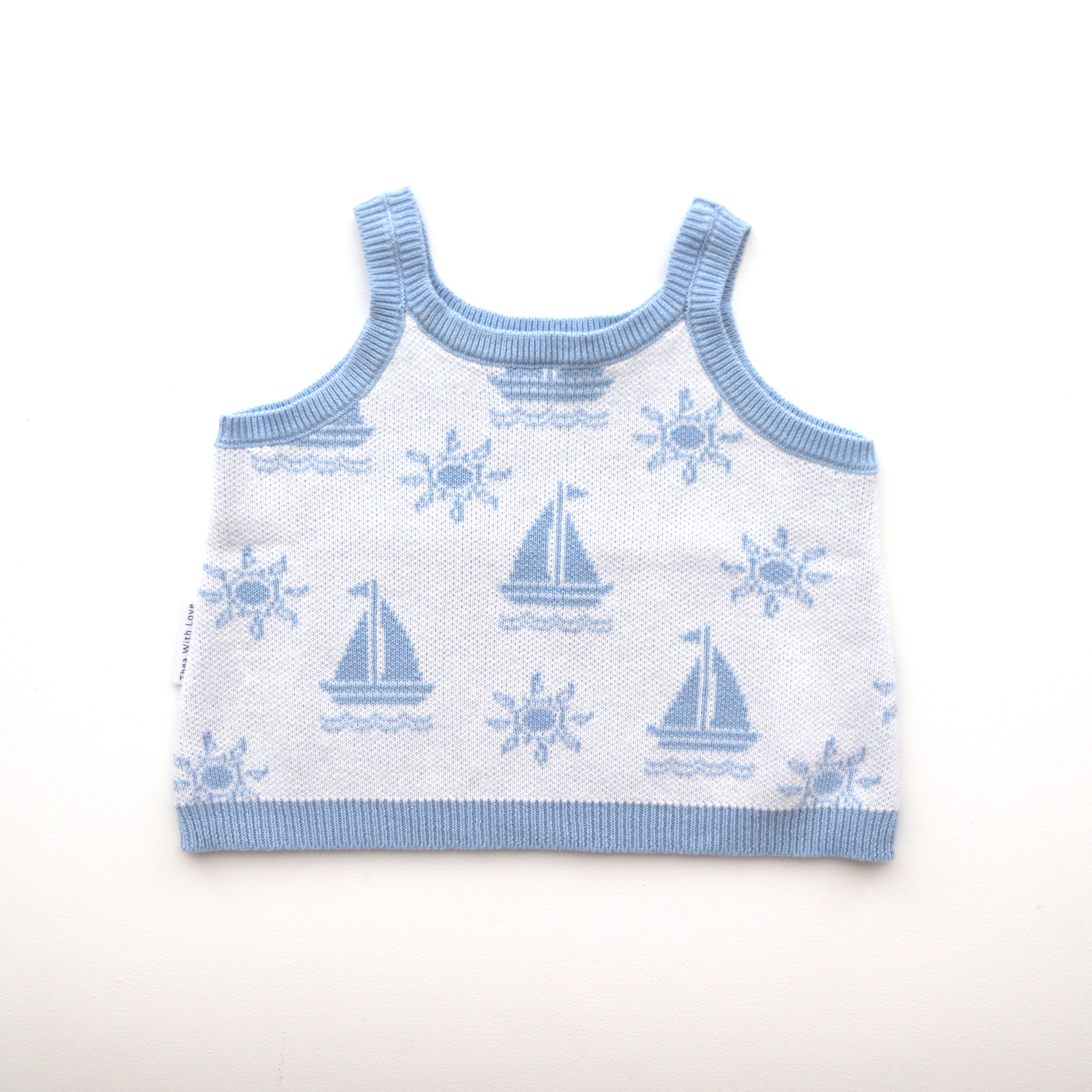 blue trim leg and waist blue boat and sun pattern on white background