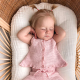 pink knitted short sleeve singlet top. eyelet wave pattern light weight frill on hem