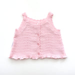 pink knitted short sleeve singlet top. eyelet wave pattern light weight frill on hem