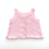 pink knitted short sleeve singlet top. eyelet wave pattern light weight frill on hem