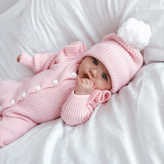 frilly-pretty-pink-romper-with matching beanie with white pom pom to natch white flower buttons