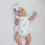 hibiscus ruffle playsuit baby 5 weeks old wearing matching bow