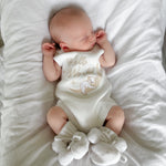 Our koala hello world summer features a baby koala sleeping on eclipse shape  moon. 2 stars are also added. The embroidery is running writing. The embroidery yarn is glossy so the hello world shines in the sunlight. Romper is white knitted fabric. short sleeves and legs for summer. 