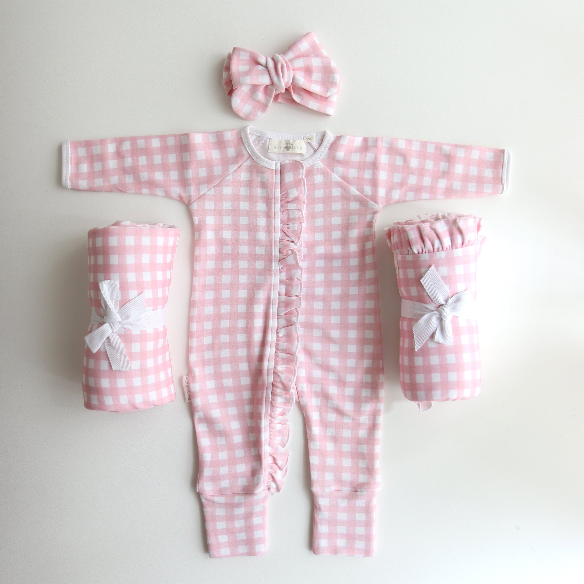 pretty-pink-gingham-onesie-growsuit-with matching bow and swaddles