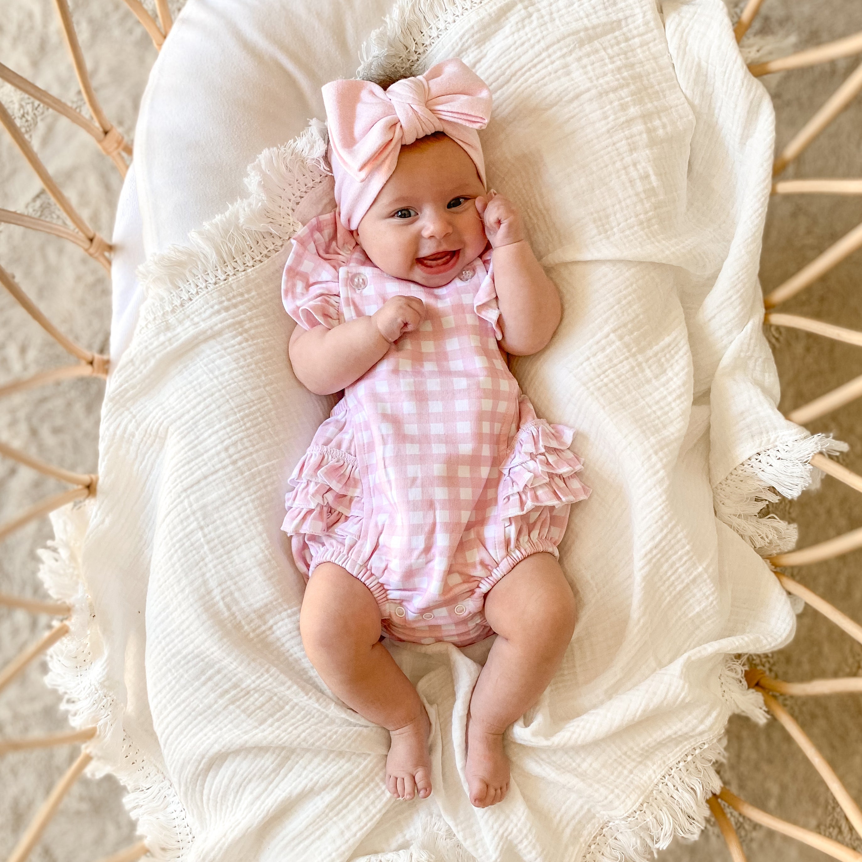 pretty-pink-ruffle_playsuit-with_matching_jacquard_knitted_bow