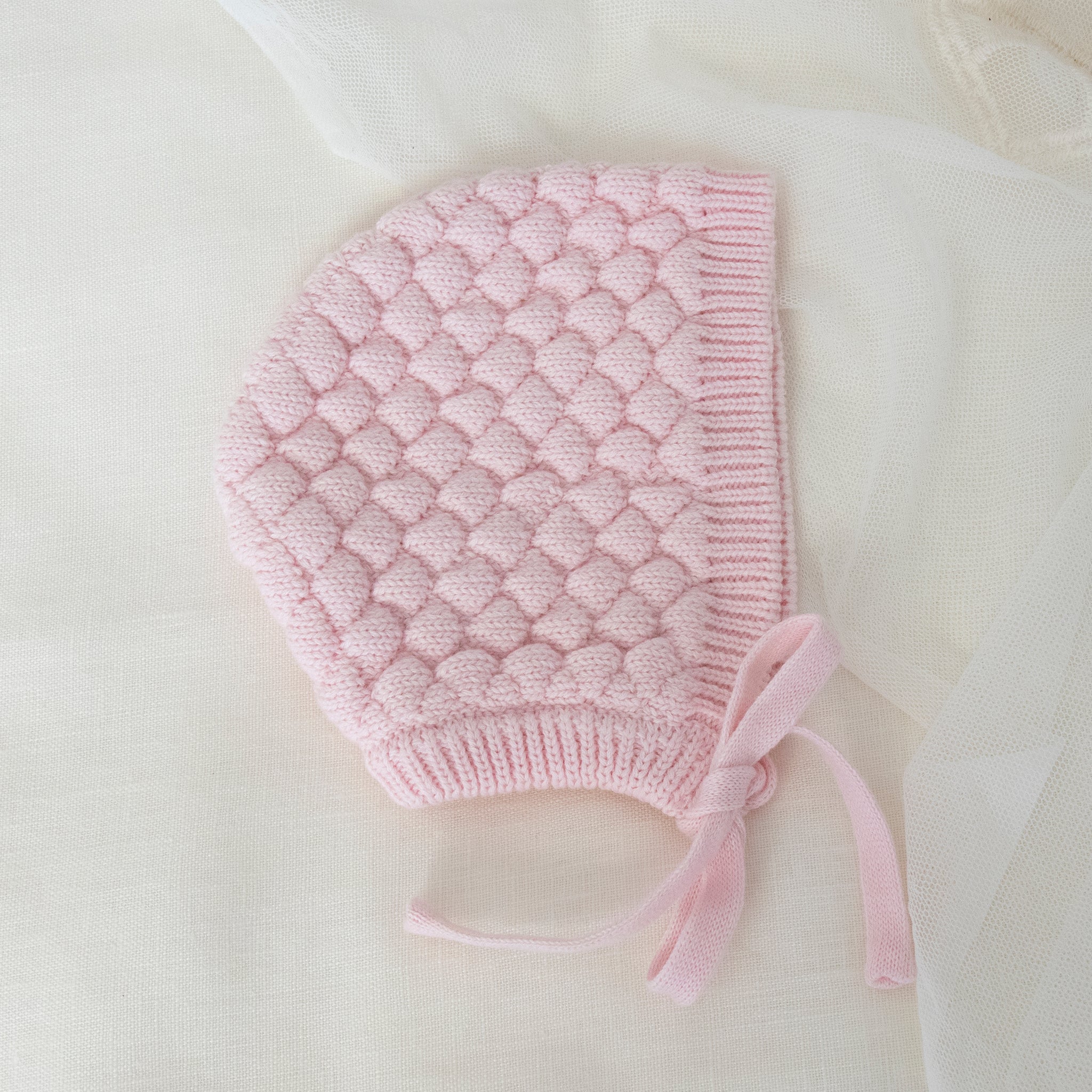baby bonnet flatlay