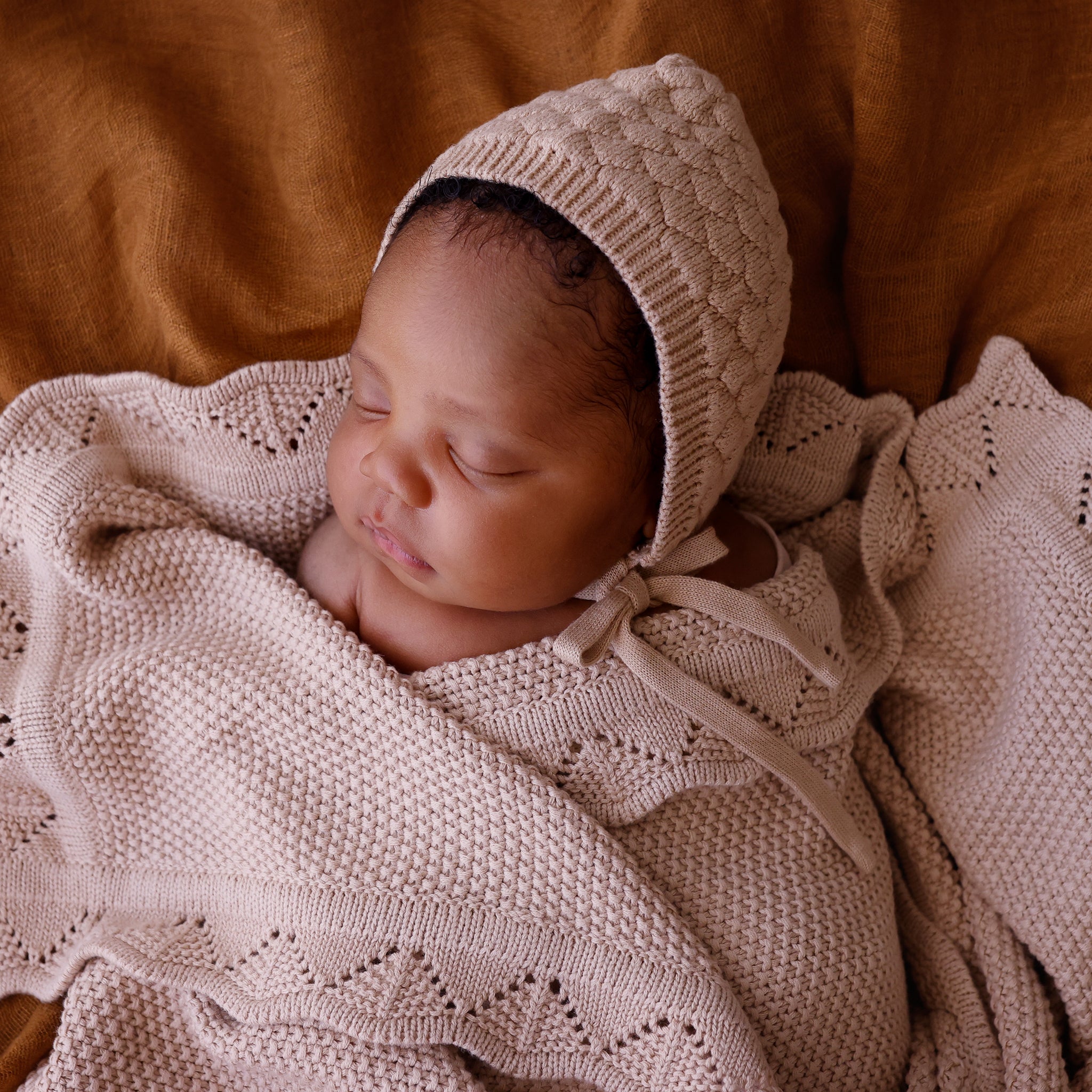 baby bonnet heirloom cotton knit tan colour matches the tan heirloom blanket.It is a keepsake