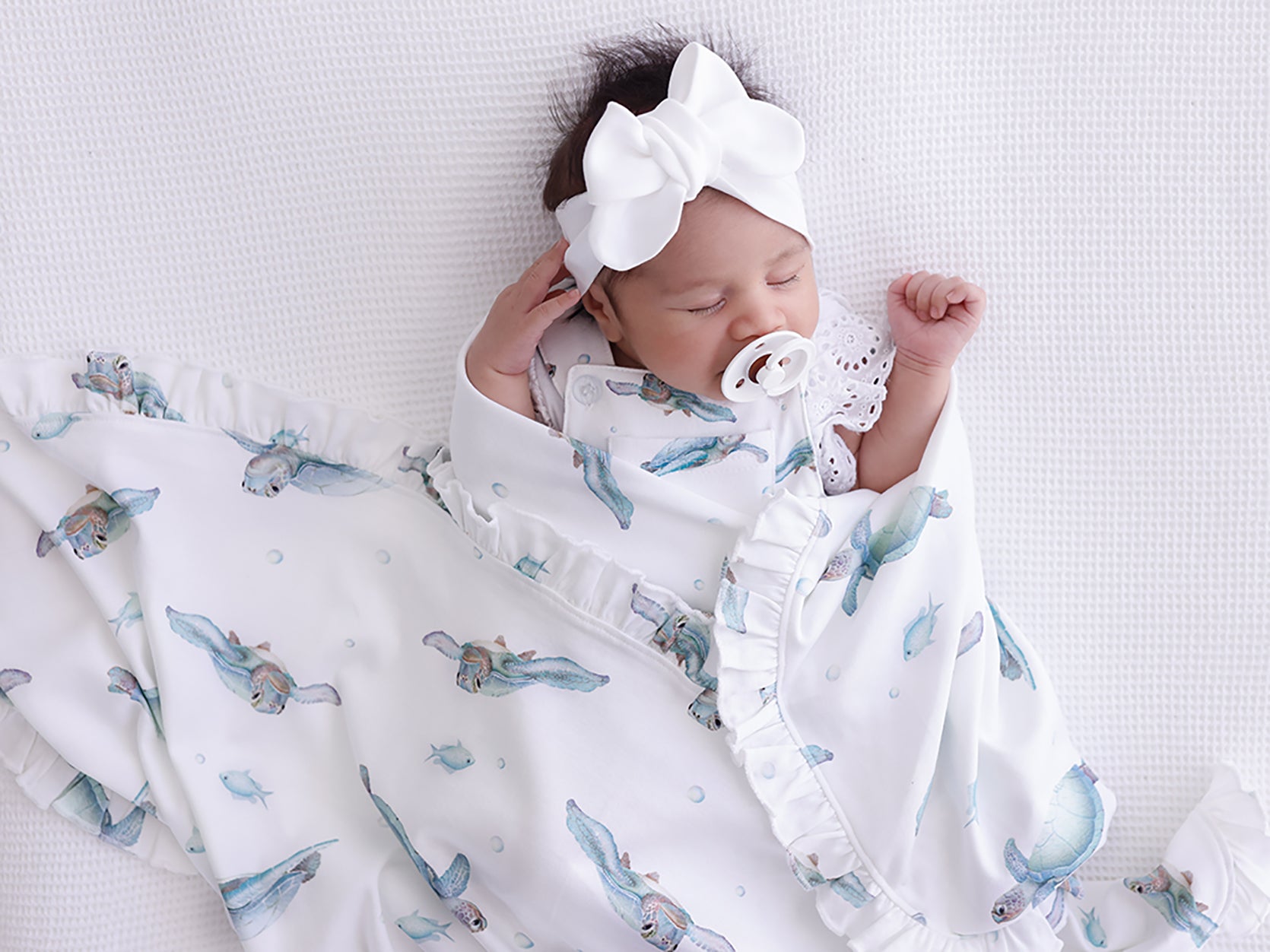ocean-turtle-frill-baby-wrap with white bow headwear
